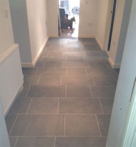 First impressions count — and the hallway is the face of your home. Grey limestone floor tiles for hallway flooring | Hallway ...
