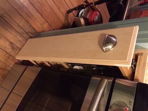There is a 3/4 wide filler and the end of that run of cabinets. Custom flller cabinet | Ana White