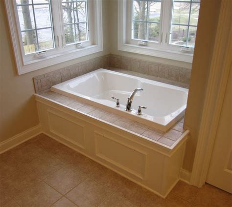 What is the story behind the idea? Master bathtub - Custom paneled front with tile tub deck ...