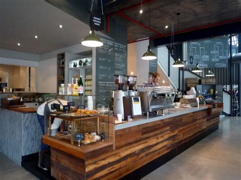 To design a coffee shop counter. Bar design using wooden paneling in mixed shades. | Coffee ...