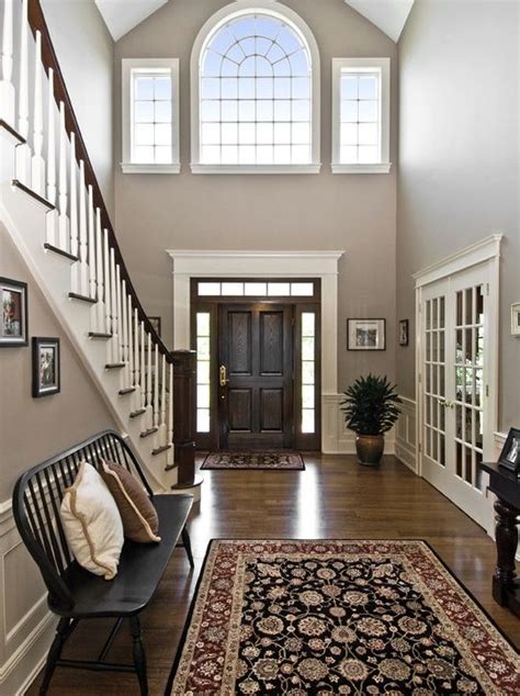 Traditional Entryway With High Ceiling Hardwood Floors