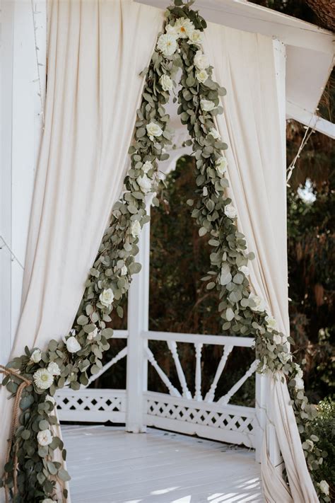 Wedding Ceremony Ideas Draped Greenery And White Roses White Curtains