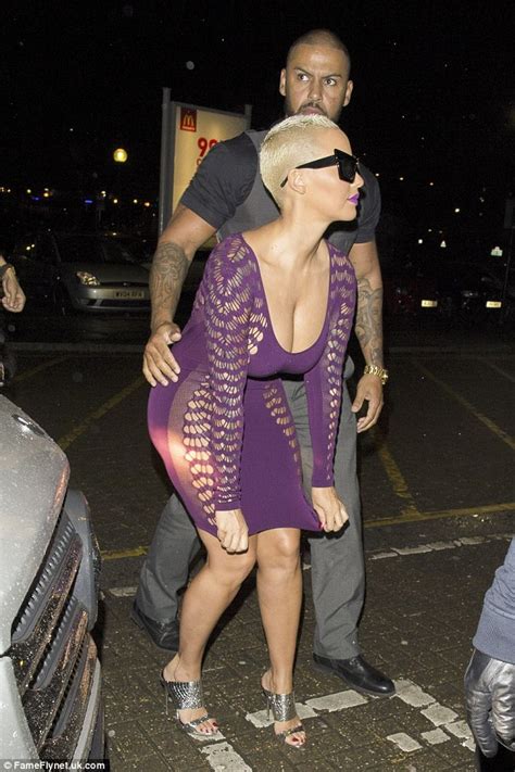 Amber Rose Shows Off Her Ample Assets In Plunging Purple Dress Daily