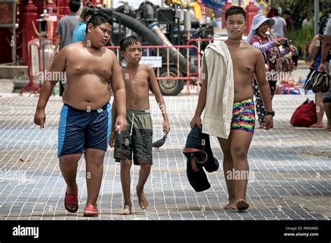 Thailand Boys Walking Shirtless Along The Street Three Young Friends