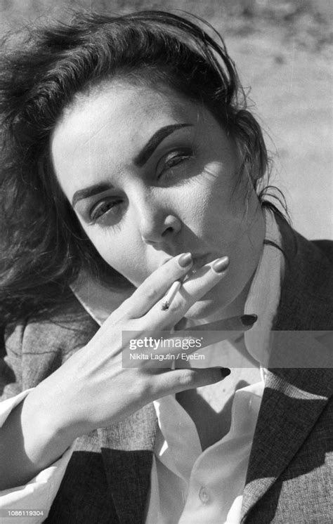 Portrait Of Woman Smoking Cigarette High Res Stock Photo