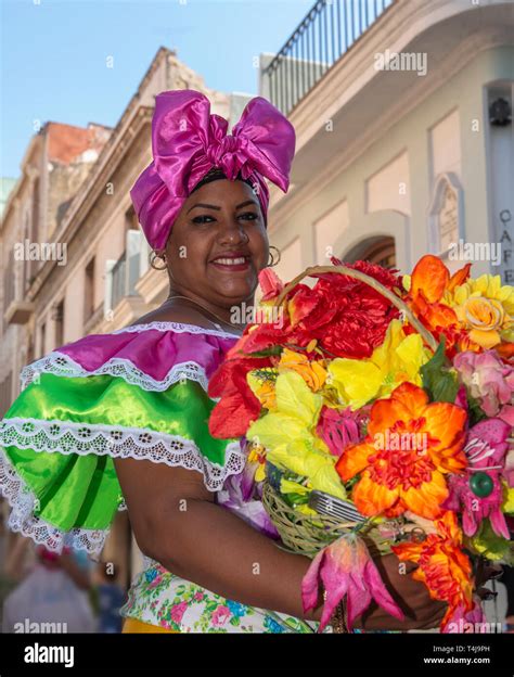 Smiling Cuban Woman With Traditional Colourful Floral Clothing Posing