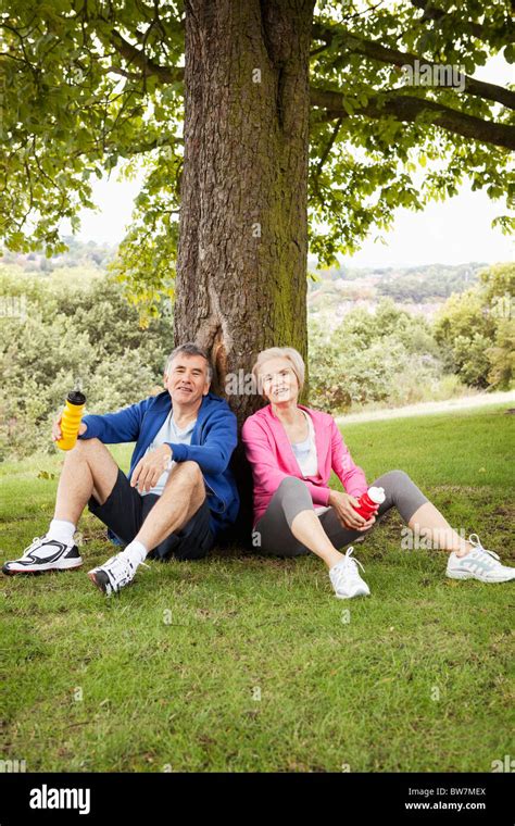 Mature Couple Resting After Exercise Stock Photo Alamy