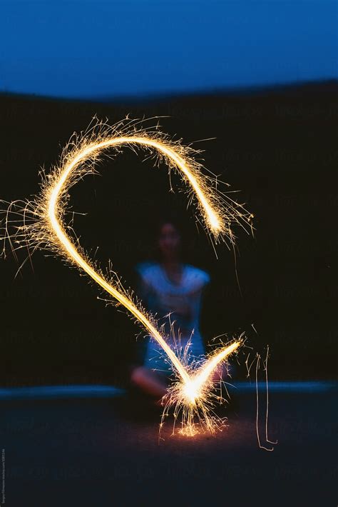 Anonymous Woman Drawing With Sparkler In Night By Stocksy Contributor Sergey Filimonov Stocksy