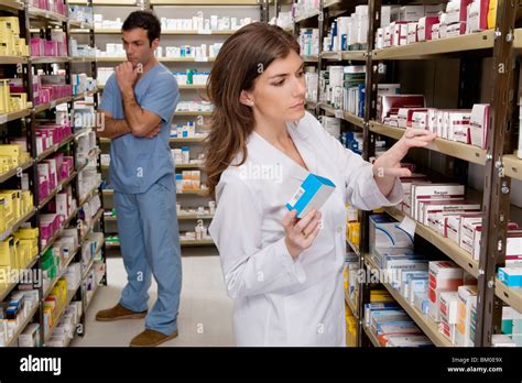 Pharmacists Working In A Pharmacy Stock Photo Alamy