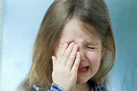 Close Up Of A Young Girl Crying Stock Photo Dissolve