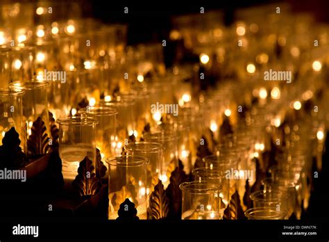 Rows Of Candles Lit In A Church In Darkness Stock Photo 67464199 Alamy