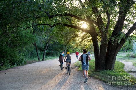 A Late Afternoon Sunset Greets Runners And Bikers On The Lady Bird Lake