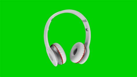White Wireless Headphones Isolated On Green Screen