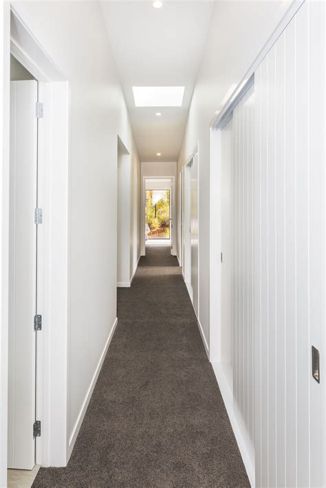 Bright Light Hallway With High Ceilings And Skylights Skylight High