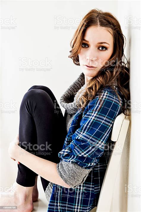 Beautiful Young Woman Sitting On Chair Stock Photo Download Image Now