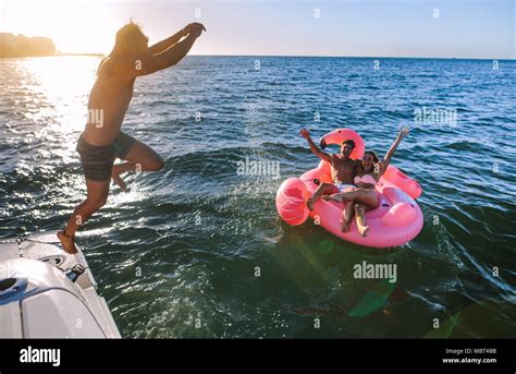 Woman Jumping Off A Boat Hi Res Stock Photography And Images Alamy