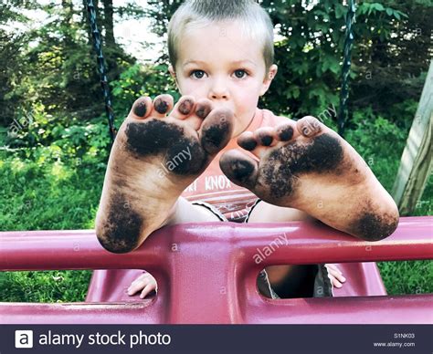 Barefeet barefoot boy feet popular all time. Little Boy showing his dirty feet Stock Photo, Royalty ...