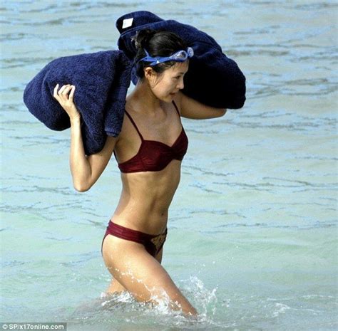 Frolicking on the beach with her billionaire ex fiancé Chinese actress
