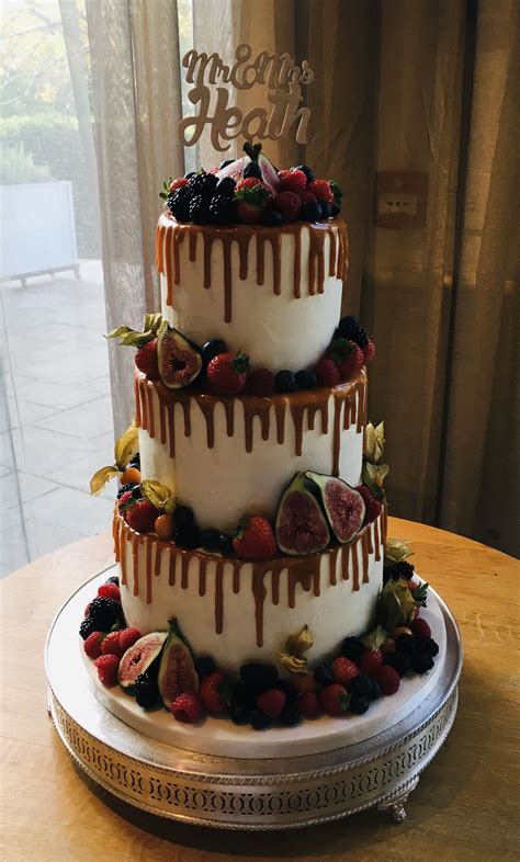Unique wedding cakes to inspire couples planning their dream reception desserts. 3 tier buttercream covered cake finished with a caramel ...