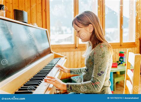 Portrait Of Adorable Little Girl Playing Piano Stock Photo Image Of