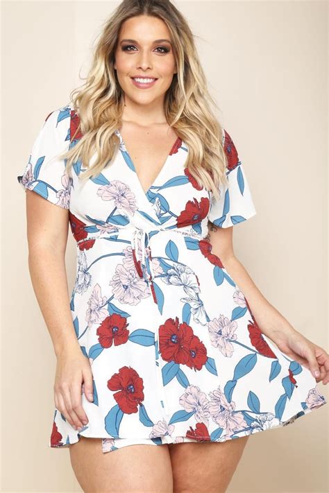 A Plus Size Mini Dress With A Wrapped V Neckline And Short Sleeves Features A Belted Waistline