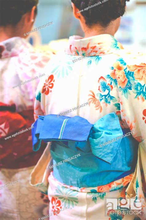 Japanese Women Wear A Traditional Dress Called Kimono For Sakura Viewing At Kiyomizu Temple In