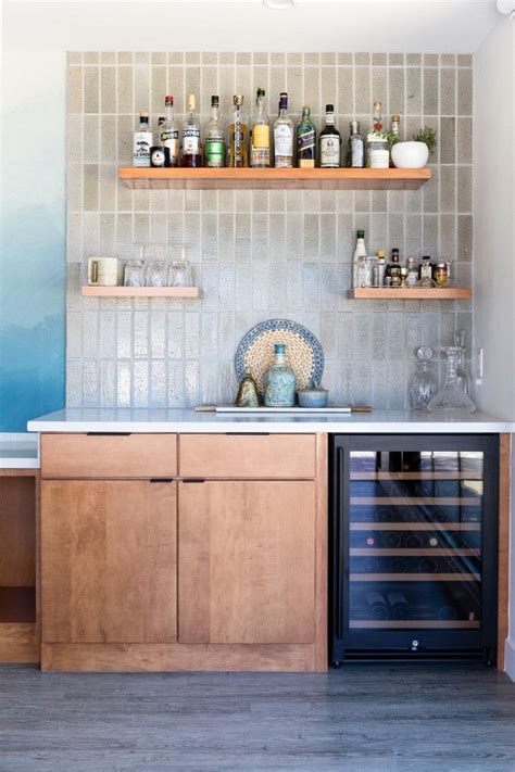 Backsplash terracotta kitchen wall tiles. Bar with flat-faced cabinet, flowating shelves and Glazed ...
