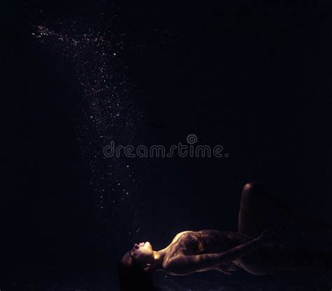Underwater Shoot Of Beautiful Woman Swimming And Relaxing In Water In
