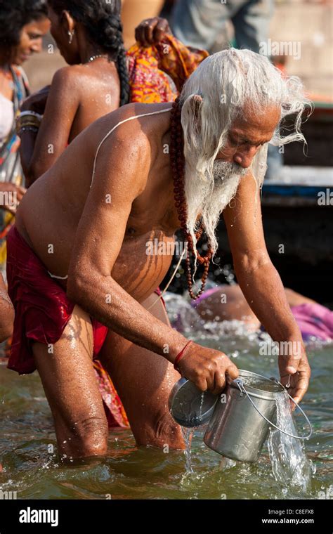 Indian Hindu Pilgrim Bathing In The Ganges River At Dashashwamedh Ghat