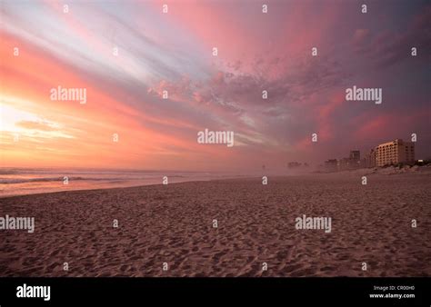 Sunset Over Deserted Sandy Beach Stock Photo Alamy