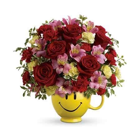 Hello, hello my glowing beauties! Growing Happiness Smiley Face Cup Bouquet at Send Flowers