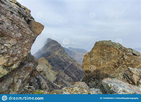 A Rocky Mountain View With Altitude White Clouds Stock Photo Image Of