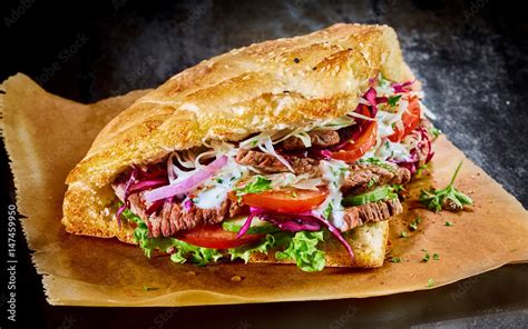 Turkish Doner Kebab On Golden Toasted Pita Bread Stock Photo Adobe Stock