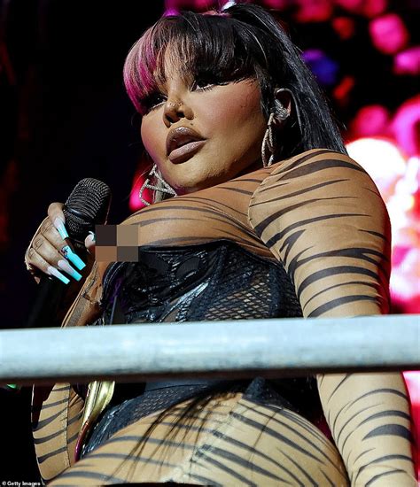 Lil Kim Puts On Busty Display In Very Sheer Tiger Print Bodysuit As She Plays Pride Island