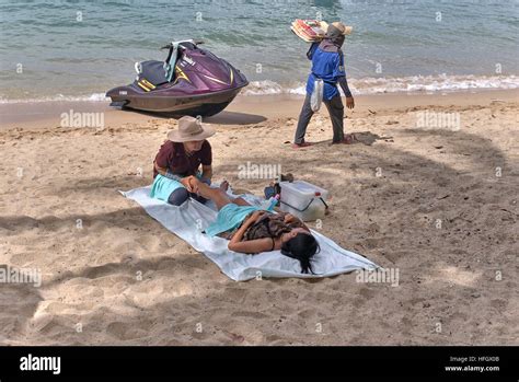 Thailand Massage Female Masseuse And Female Customer Receiving A Massage On The Beach Pattaya