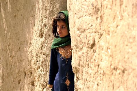 A Beautiful Afghan Girl Standing Outside Her House In Musa Qala