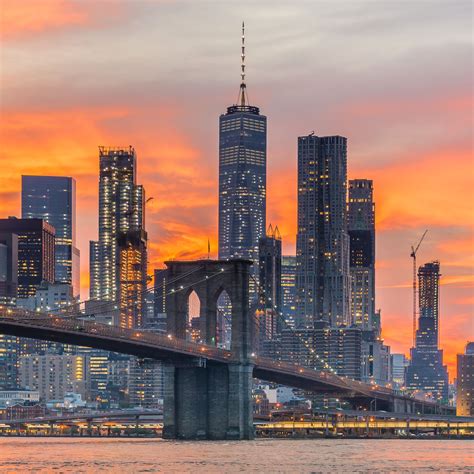 Sunset Over Lower Manhattan And The Brooklyn Bridge In New York City