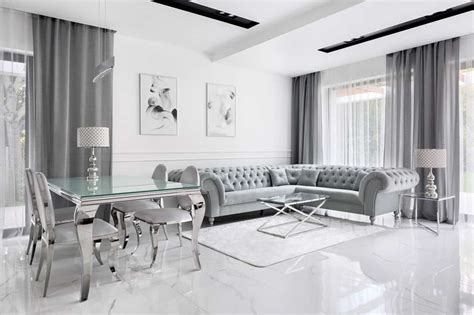 This classy living room has a white ceiling that matches the white upholstery on the sofa set and the white fireplace. White and Silver Bedroom Decor Ideas - Home Decor Bliss