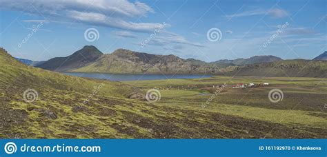 Panoramic Landscape With Mountain Huts At Camping Site On Blue