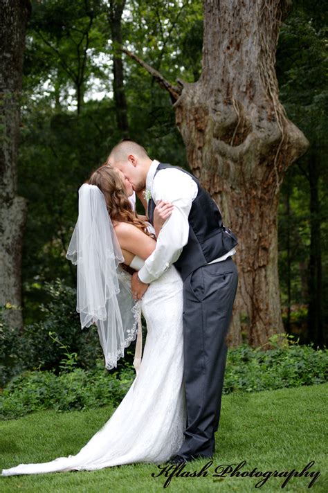 husband and wife kiss wife kissing wedding dresses couple photos