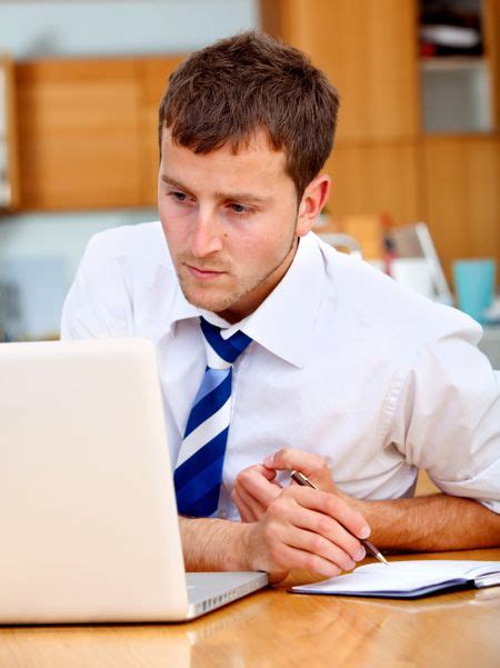 Concentrated Business Man Working At An Office Freestock Photos