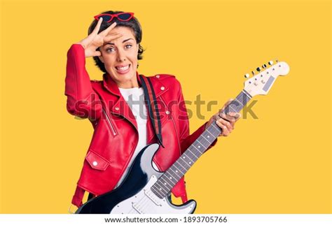Young Beautiful Woman Playing Electric Guitar Stock Photo 1893705766