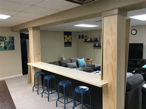 Custom Built In Wood Bar In Basement Between Two Support Posts In