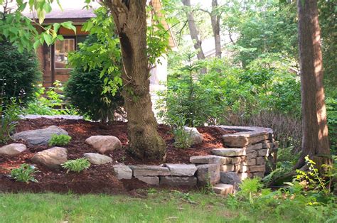 This retaining wall is meticulously built with a repeating pattern and precise measurements. images of retaining walls | Stone Retaining Wall ...