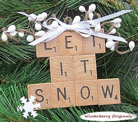 A Christmas Ornament Made Out Of Scrabbles And Wood Blocks With Words