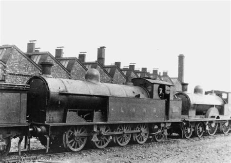 Nuneaton Shed Ex LNWR T F No Is Seen Standing In Line In Front Of An Unidentified Ex