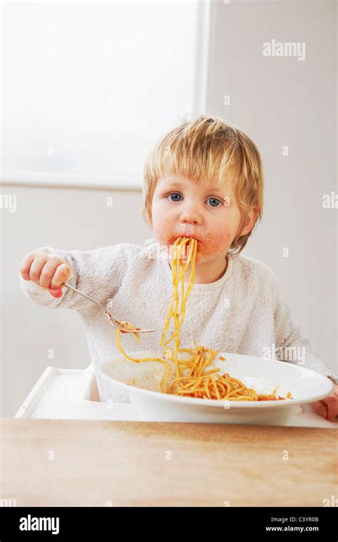 Messy Baby Boy Eating Spaghetti Stock Photo Alamy