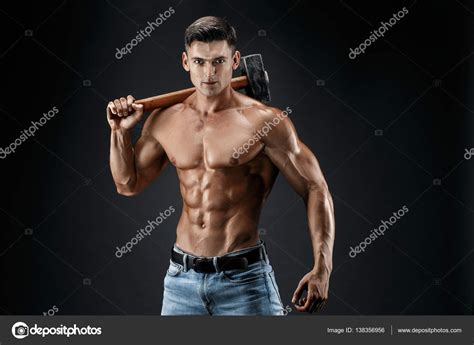 Muscular Man With Naked Torso Holding Big Hummer Isolated On Dark Grey