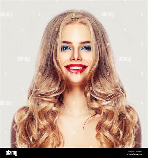 Beautiful Woman With Long Healthy Blonde Hair Makeup And Cute Smile