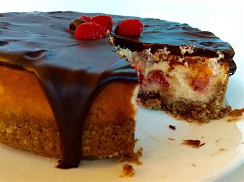 I made a raspberry coulis and created a marble effect on the top and the outcome was fab. Chocolate-Covered Raspberry Cheesecake - Chocolates & Chai